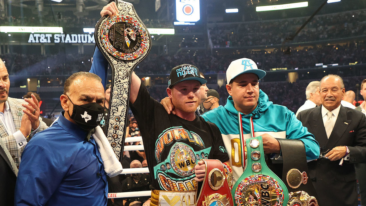 ARLINGTON, TEXAS - MAY 08: Canelo Alvarez celebrates after defeating Billy Joe Saunders who did not answer the bell for the eighth round during their fight for Alvarez's WBC and WBA super middleweight titles and Saunders' WBO super middleweight title at AT&T Stadium on May 08, 2021 in Arlington, Texas.