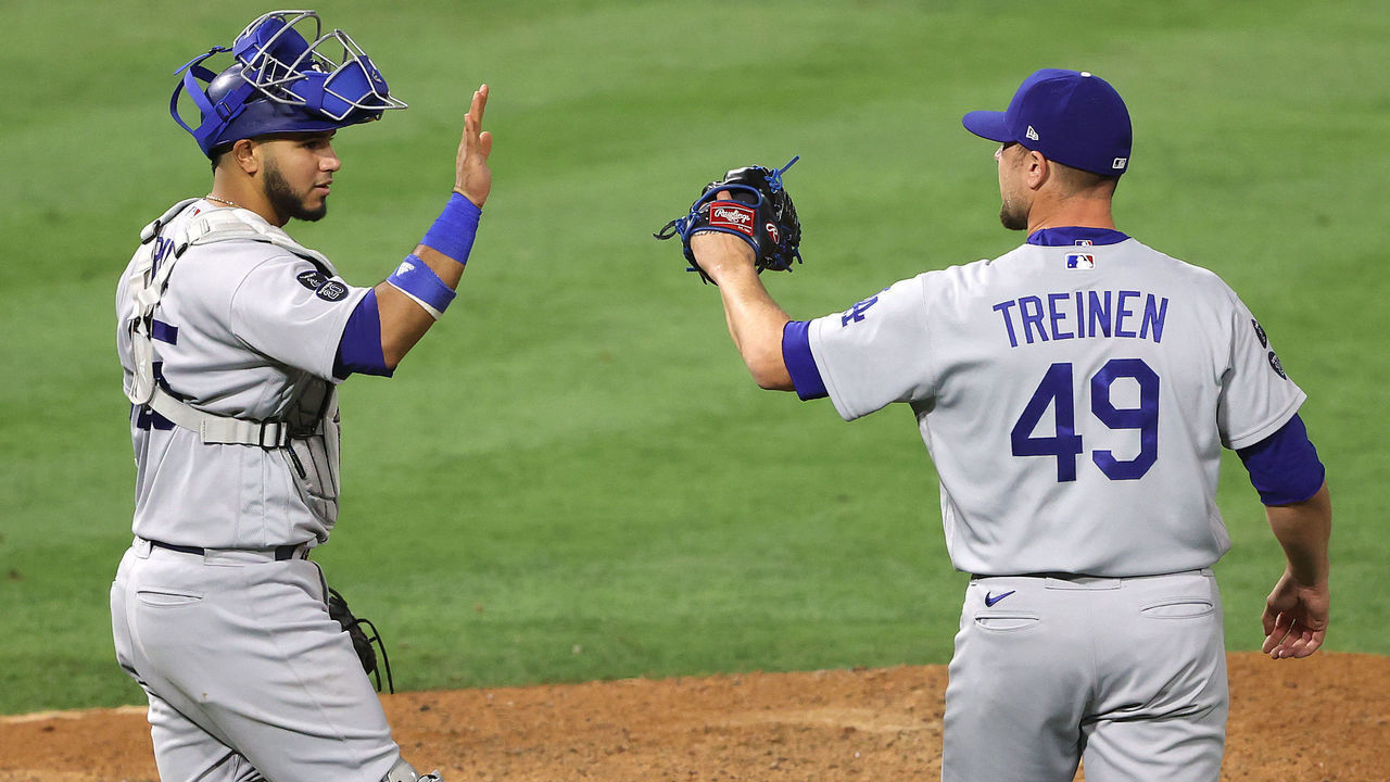 ANAHEIM, CALIFORNIA - MAY 08: Keibert Ruiz #25 and Blake Treinen #49 of the Los Angeles Dodgers celebrate defeating the Los Angeles Angels 14-11 in a game at Angel Stadium of Anaheim on May 08, 2021 in Anaheim, California.