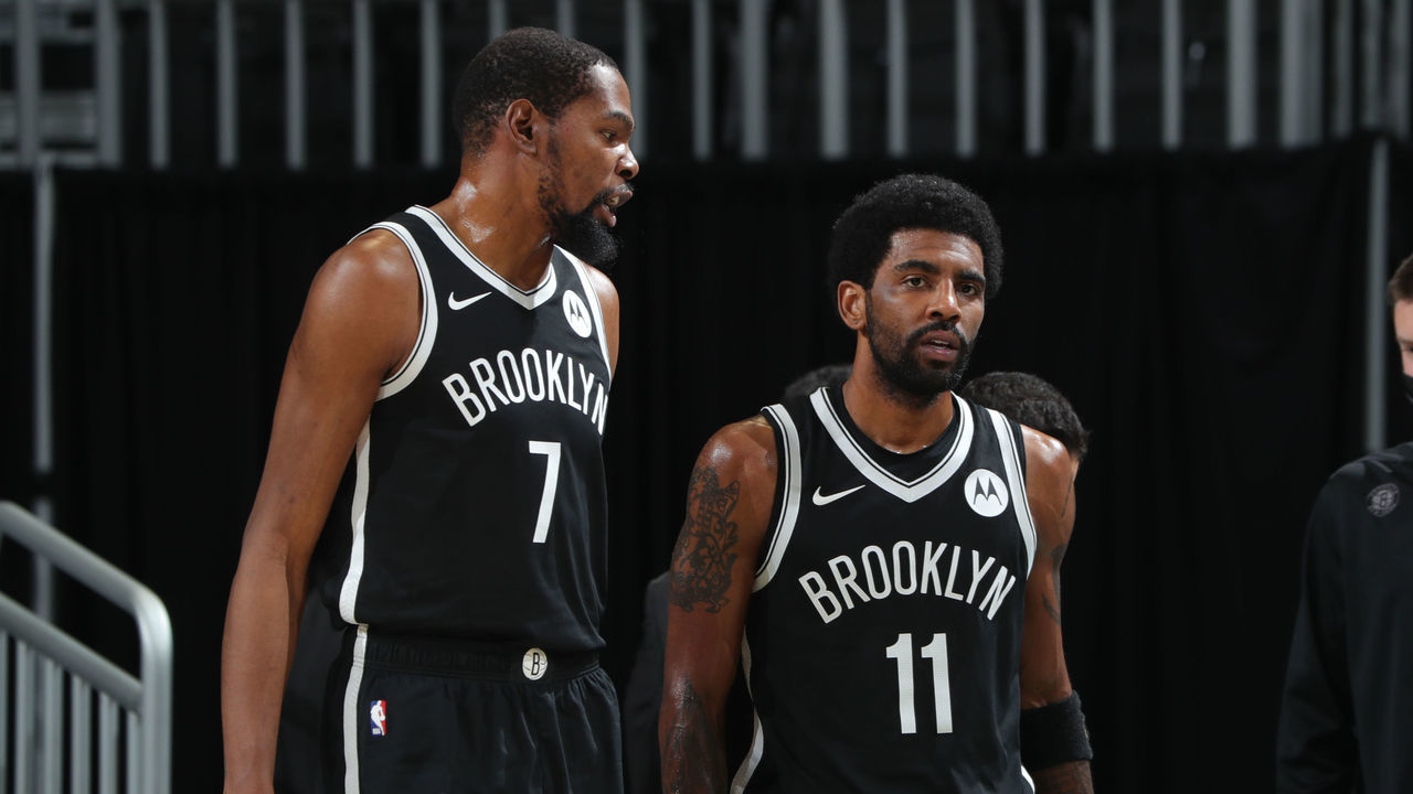 MILWAUKEE, WI - MAY 4: Kevin Durant #7 talks with Kyrie Irving #11 of the Brooklyn Nets during the game against the Milwaukee Bucks on May 4, 2021 at the Fiserv Forum Center in Milwaukee, Wisconsin. Mandatory Copyright Notice: Copyright 2021 NBAE .