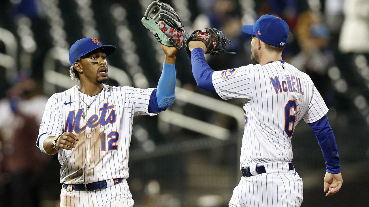 NEW YORK, NEW YORK - APRIL 14: (NEW YORK DAILIES OUT) Francisco Lindor #12 and Jeff McNeil #6 of the New York Mets celebrate after defeating the Philadelphia Phillies at Citi Field on April 14, 2021 in New York City. The Mets defeated the Phillies 5-1.