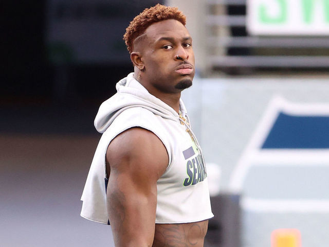 SEATTLE, WASHINGTON - JANUARY 09: DK Metcalf #14 of the Seattle Seahawks warms up before the NFC Wild Card Playoff game against the Los Angeles Rams at Lumen Field on January 09, 2021 in Seattle, Washington.