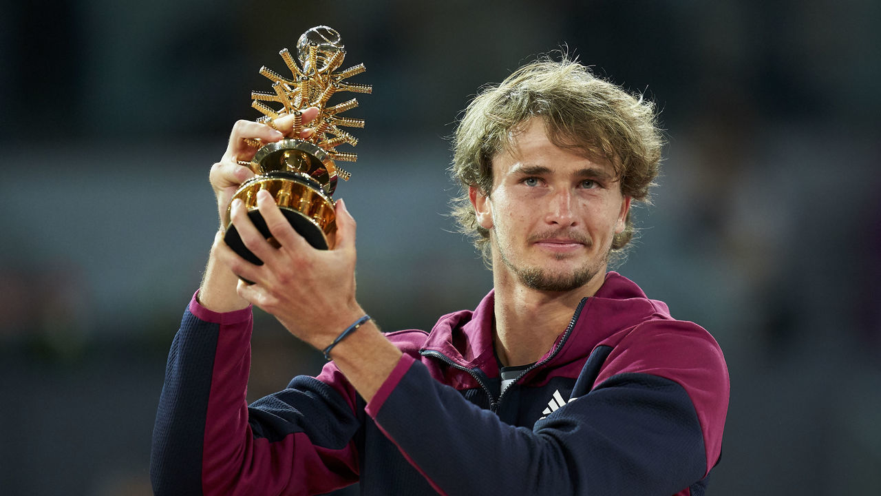 MADRID, SPAIN - MAY 09: Alexander Zverev of Germany celebrates with the trophy following victory against Matteo Berrettini of Italy in the Mutua Madrid Open Final on day eleven of the Mutua Madrid Open tennis tournament at La Caja Magica on May 09, 2021 in Madrid, Spain.
