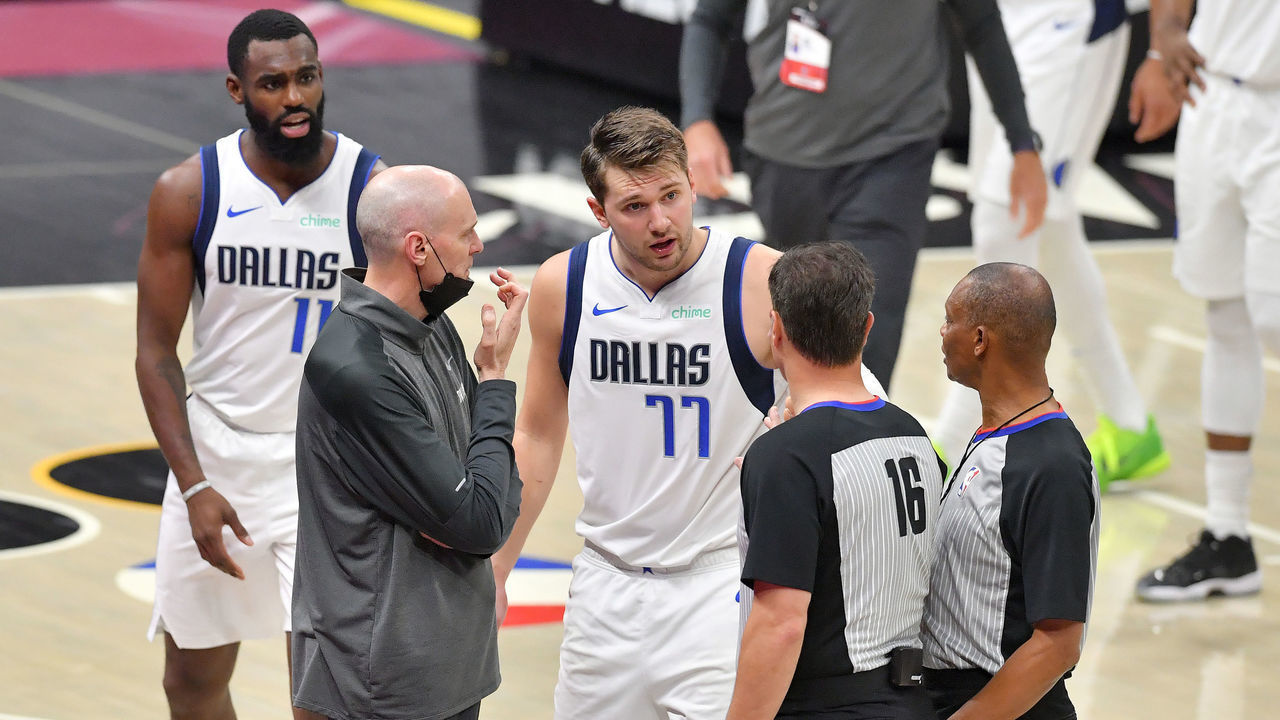 CLEVELAND, OHIO - MAY 09: Head coach Rick Carlisle and Luka Doncic #77 of the Dallas Mavericks argue with referees David Guthrie #16 and Michael Smith #38 during the third quarter of the game between the Dallas Mavericks and the Cleveland Cavaliers at Rocket Mortgage Fieldhouse on May 09, 2021 in Cleveland, Ohio. NOTE TO USER: User expressly acknowledges and agrees that, by downloading and/or using this photograph, user is consenting to the terms and conditions of the Getty Images License Agreement.