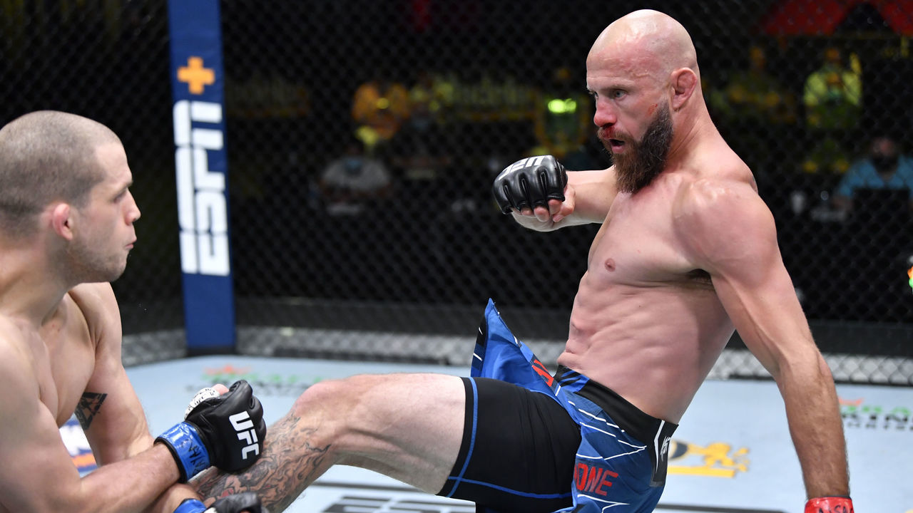 LAS VEGAS, NEVADA - MAY 08: In this handout image provided by UFC, (R-L) Donald 'Cowboy' Cerrone kicks Alex Morono in a welterweight fight during the UFC Fight Night event at UFC APEX on May 08, 2021 in Las Vegas, Nevada.