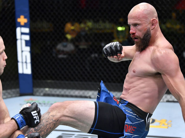 LAS VEGAS, NEVADA - MAY 08: In this handout image provided by UFC, (R-L) Donald 'Cowboy' Cerrone kicks Alex Morono in a welterweight fight during the UFC Fight Night event at UFC APEX on May 08, 2021 in Las Vegas, Nevada.