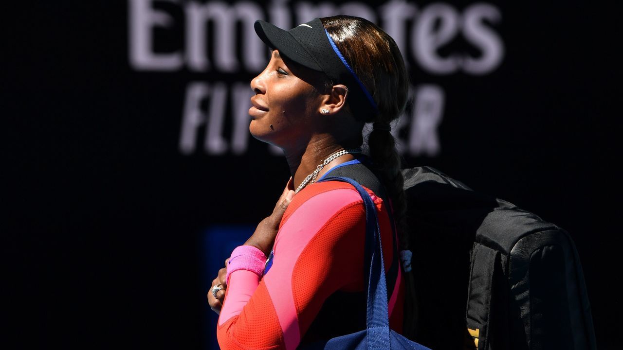 Serena Williams of the US reacts after losing to Japan's Naomi Osaka in their women's singles semi-final match on day eleven of the Australian Open tennis tournament in Melbourne on February 18, 2021.