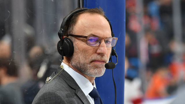 EDMONTON, AB - MARCH 13: Ray Ferraro watches warm up prior to the game between the Edmonton Oilers and the New Jersey Devils on March 13, 2019 at Rogers Place in Edmonton, Alberta, Canada.