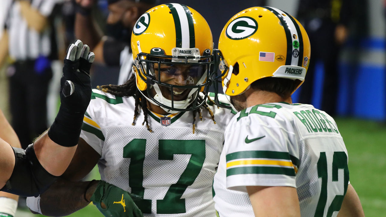 DETROIT, MICHIGAN - DECEMBER 13: Aaron Rodgers #12 of the Green Bay Packers celebrates rushing for a touchdown with Davante Adams #17 of the Green Bay Packers during the third quarter against the Detroit Lions at Ford Field on December 13, 2020 in Detroit, Michigan.