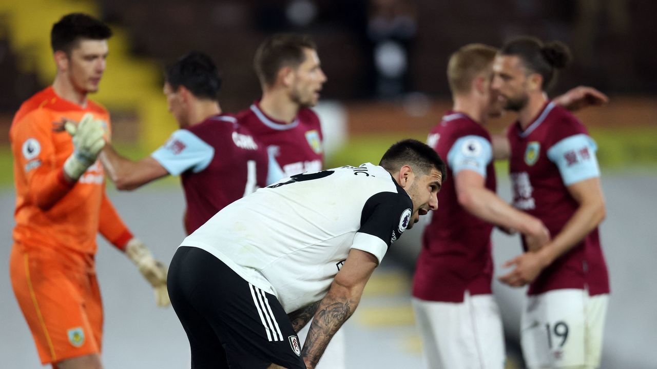 Fulham's Serbian striker Aleksandar Mitrovic reacts after the English Premier League football match between Fulham and Burnley at Craven Cottage in London on May 10, 2021. - RESTRICTED TO EDITORIAL USE. No use with unauthorized audio, video, data, fixture lists, club/league logos or 'live' services. Online in-match use limited to 120 images. An additional 40 images may be used in extra time. No video emulation. Social media in-match use limited to 120 images. An additional 40 images may be used in extra time. No use in betting publications, games or single club/league/player publications.