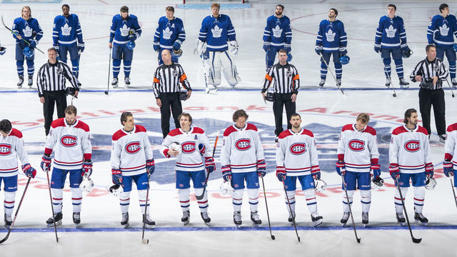 TORONTO, ON - JANUARY 13: Players from the Toronto Maple Leafs and Montreal Canadiens stand for the national anthem before the start of the game at the Scotiabank Arena on January 13, 2021 in Toronto, Ontario, Canada.