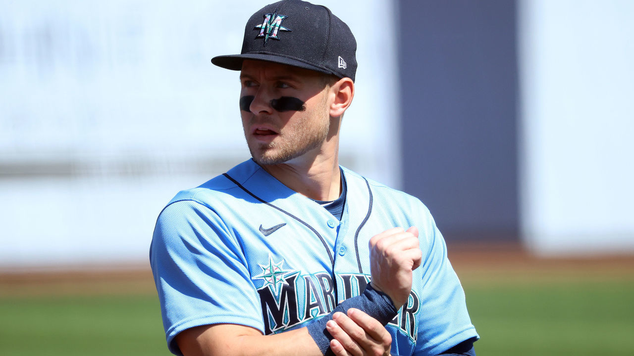 PHOENIX, ARIZONA - MARCH 21: Jarred Kelenic #10 of the Seattle Mariners looks on before the MLB spring training game against the Milwaukee Brewers at American Family Fields of Phoenix on March 21, 2021 in Phoenix, Arizona.