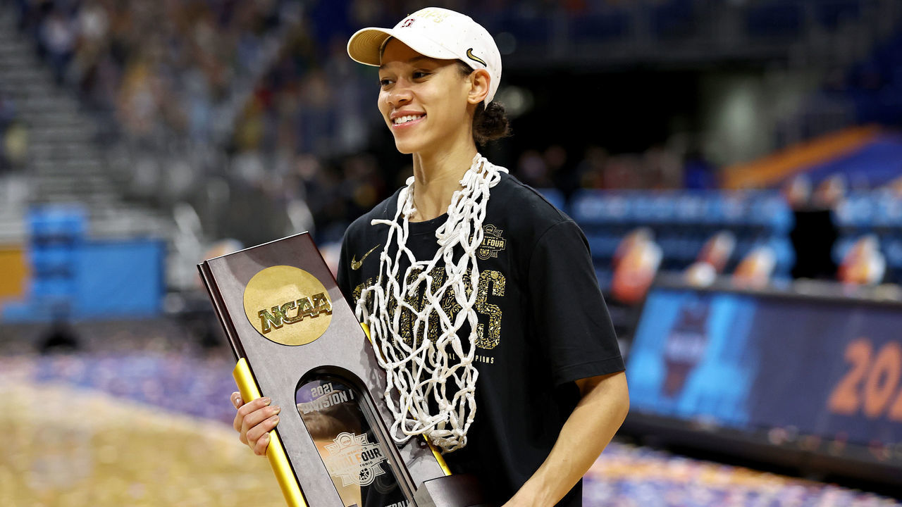 SAN ANTONIO, TEXAS - APRIL 04: Anna Wilson #3 of the Stanford Cardinal celebrates with the trophy following the team's win against the Arizona Wildcats in the National Championship game of the 2021 NCAA Women's Basketball Tournament at the Alamodome on April 04, 2021 in San Antonio, Texas.