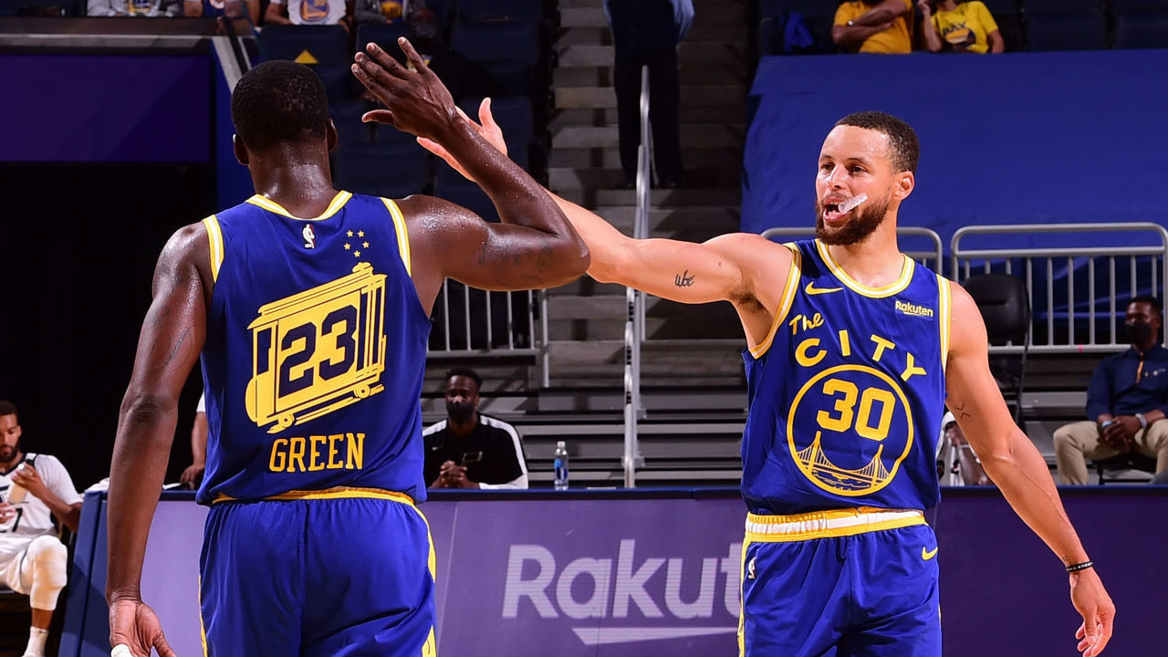 SAN FRANCISCO, CA - MAY 10: Draymond Green #23 hi-fives Stephen Curry #30 of the Golden State Warriors during the game against the Utah Jazz on May 10, 2021 at Chase Center in San Francisco, California. NOTE TO USER: User expressly acknowledges and agrees that, by downloading and or using this photograph, user is consenting to the terms and conditions of Getty Images License Agreement. Mandatory Copyright Notice: Copyright 2021 NBAE