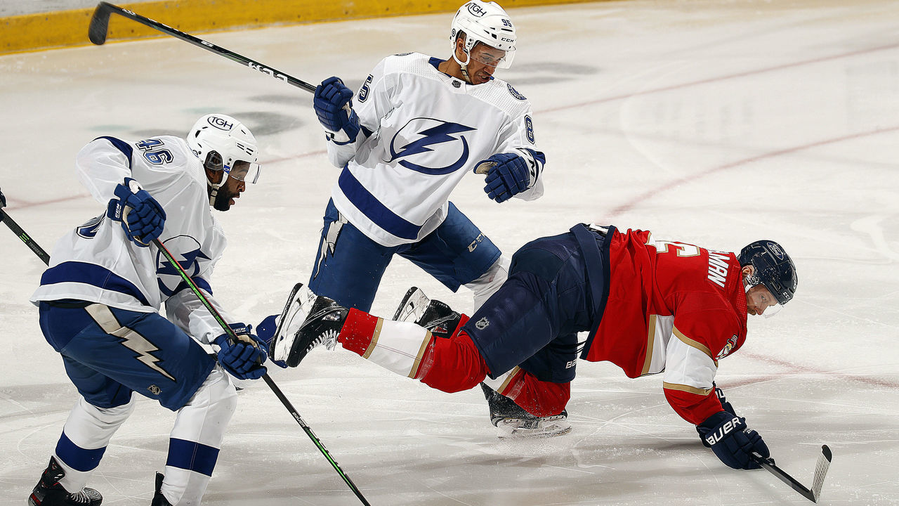 SUNRISE, FL - MAY 10: Germel Smith #46 and teammate Daniel Walcott #85 of the Tampa Bay Lightning tangle with Anton Stralman #6 of the Florida Panthers at the BB&T Center on May 10, 2021 in Sunrise, Florida.