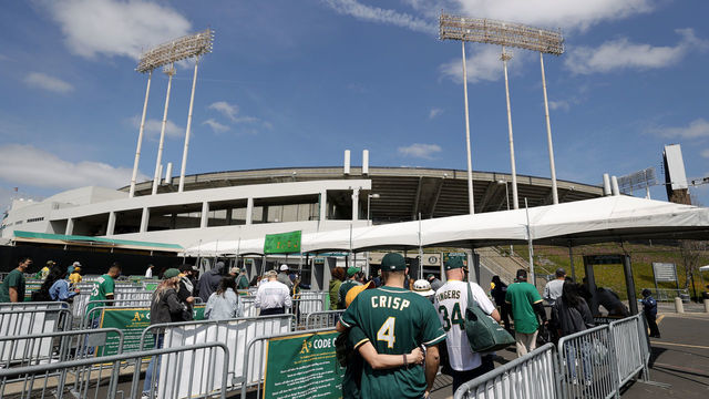 OAKLAND, CALIFORNIA - APRIL 03: Fans enter the stadium for the Oakland Athletics game against the Houston Astros at RingCentral Coliseum on April 03, 2021 in Oakland, California.