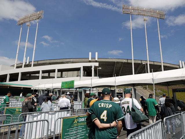 OAKLAND, CALIFORNIA - APRIL 03: Fans enter the stadium for the Oakland Athletics game against the Houston Astros at RingCentral Coliseum on April 03, 2021 in Oakland, California.