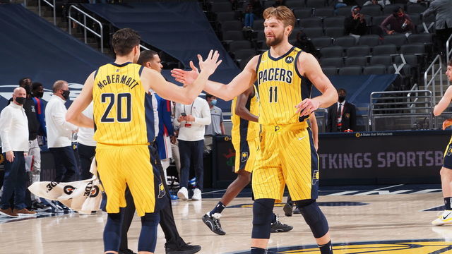 INDIANAPOLIS, IN - MAY 11: Doug McDermott #20 of the Indiana Pacers high fives Domantas Sabonis #11 of the Indiana Pacers during the game against the Philadelphia 76ers on May 11, 2021 at Bankers Life Fieldhouse in Indianapolis, Indiana. Mandatory Copyright Notice: Copyright 2021 NBAE