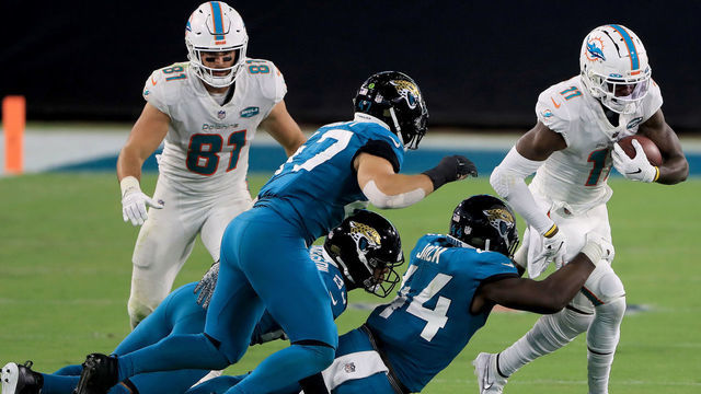 JACKSONVILLE, FLORIDA - SEPTEMBER 24: DeVante Parker #11 of the Miami Dolphins runs for yardage during the game at TIAA Bank Field on September 24, 2020 in Jacksonville, Florida.