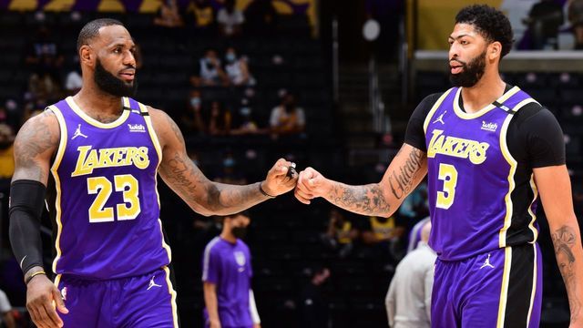 LOS ANGELES, CA - APRIL 30: LeBron James #23 and Anthony Davis #3 of the Los Angeles Lakers touch knuckles during the game against the Sacramento Kings on April 30, 2021 at STAPLES Center in Los Angeles, California. NOTE TO USER: User expressly acknowledges and agrees that, by downloading and/or using this Photograph, user is consenting to the terms and conditions of the Getty Images License Agreement. Mandatory Copyright Notice: Copyright 2021 NBAE