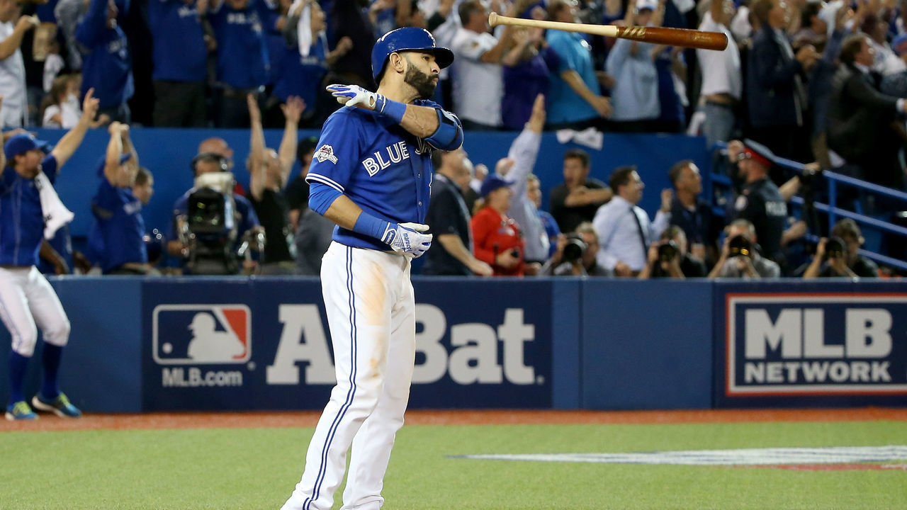 TORONTO, ON - OCTOBER 14: Jose Bautista #19 of the Toronto Blue Jays flips his bat up in the air after he hits a three-run home run in the seventh inning against the Texas Rangers in game five of the American League Division Series at Rogers Centre on October 14, 2015 in Toronto, Canada.