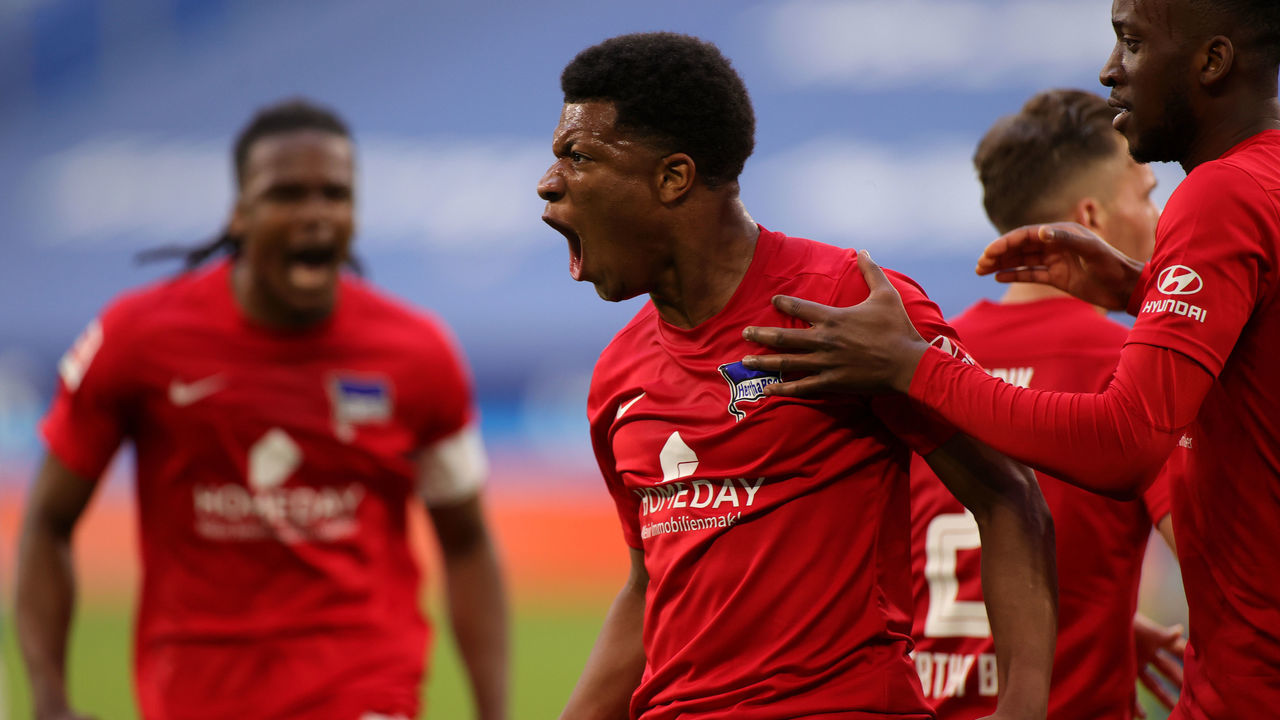 GELSENKIRCHEN, GERMANY - MAY 12: Jessic Ngankam of Hertha BSC celebrates after scoring their side's second goal during the Bundesliga match between FC Schalke 04 and Hertha BSC at Veltins-Arena on May 12, 2021 in Gelsenkirchen, Germany. Sporting stadiums around Germany remain under strict restrictions due to the Coronavirus Pandemic as Government social distancing laws prohibit fans inside venues resulting in games being played behind closed doors. (Photo Friedemann Vogel - Pool/Getty Images)