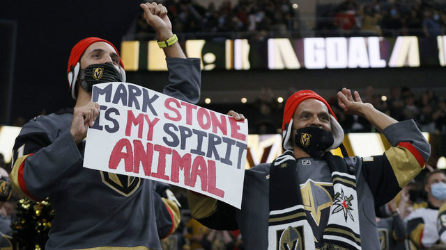LAS VEGAS, NEVADA - MAY 10: Vegas Golden Knights fans Joey Ramjeeawon (L) and his father Jack Ramjeeawon, both of Nevada, hold up a sign for Mark Stone #61 of the Golden Knights after he assisted Alex Pietrangelo #7 on a first-period goal against the Colorado Avalanche during their game at T-Mobile Arena on May 10, 2021 in Las Vegas, Nevada.