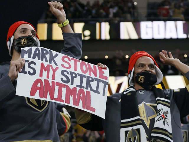 LAS VEGAS, NEVADA - MAY 10: Vegas Golden Knights fans Joey Ramjeeawon (L) and his father Jack Ramjeeawon, both of Nevada, hold up a sign for Mark Stone #61 of the Golden Knights after he assisted Alex Pietrangelo #7 on a first-period goal against the Colorado Avalanche during their game at T-Mobile Arena on May 10, 2021 in Las Vegas, Nevada.