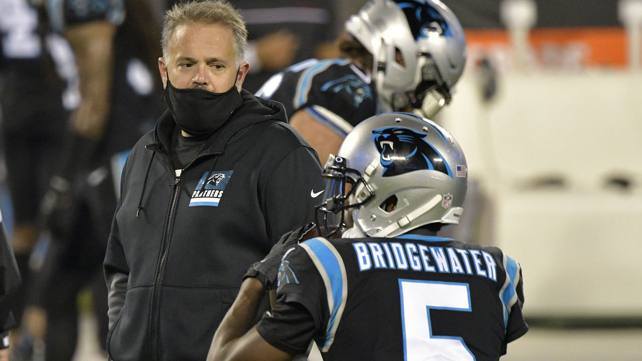 CHARLOTTE, NORTH CAROLINA - OCTOBER 29: Head coach Matt Rhule of the Carolina Panthers watches Teddy Bridgewater #5 during warm ups against the Atlanta Falcons at Bank of America Stadium on October 29, 2020 in Charlotte, North Carolina.