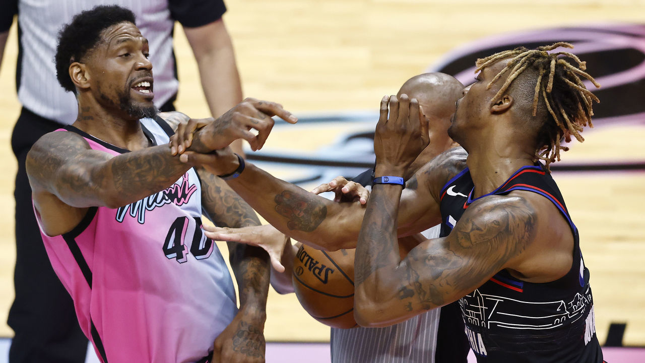 MIAMI, FLORIDA - MAY 13: Udonis Haslem #40 of the Miami Heat and Dwight Howard #39 of the Philadelphia 76ers are broken up by referee Sean Corbin #33 while being involved in a scuffle during the second quarter at American Airlines Arena on May 13, 2021 in Miami, Florida.