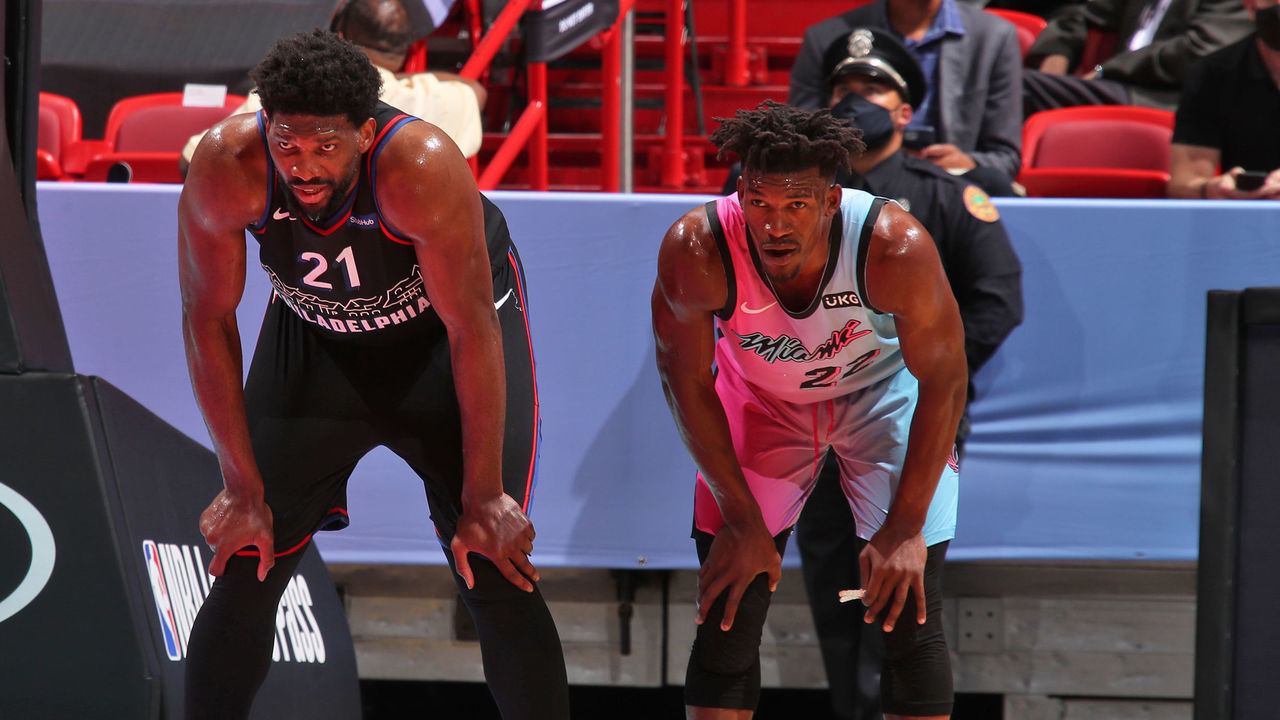 MIAMI, FL - MAY 13: Joel Embiid #21 of the Philadelphia 76ers looks on with Jimmy Butler #22 of the Miami Heat during the game on May 13, 2021 at American Airlines Arena in Miami, Florida. Mandatory Copyright Notice: Copyright 2021 NBAE