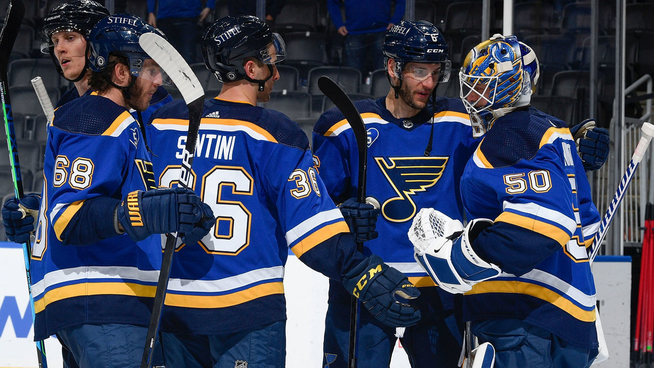 ST. LOUIS, MO - MAY 13: Steven Santini #36 Marco Scandella #6 and Jordan Binnington #50 of the St. Louis Blues celebrate their victory over the Minnesota Wild on May 13, 2021 at the Enterprise Center in St. Louis, Missouri.