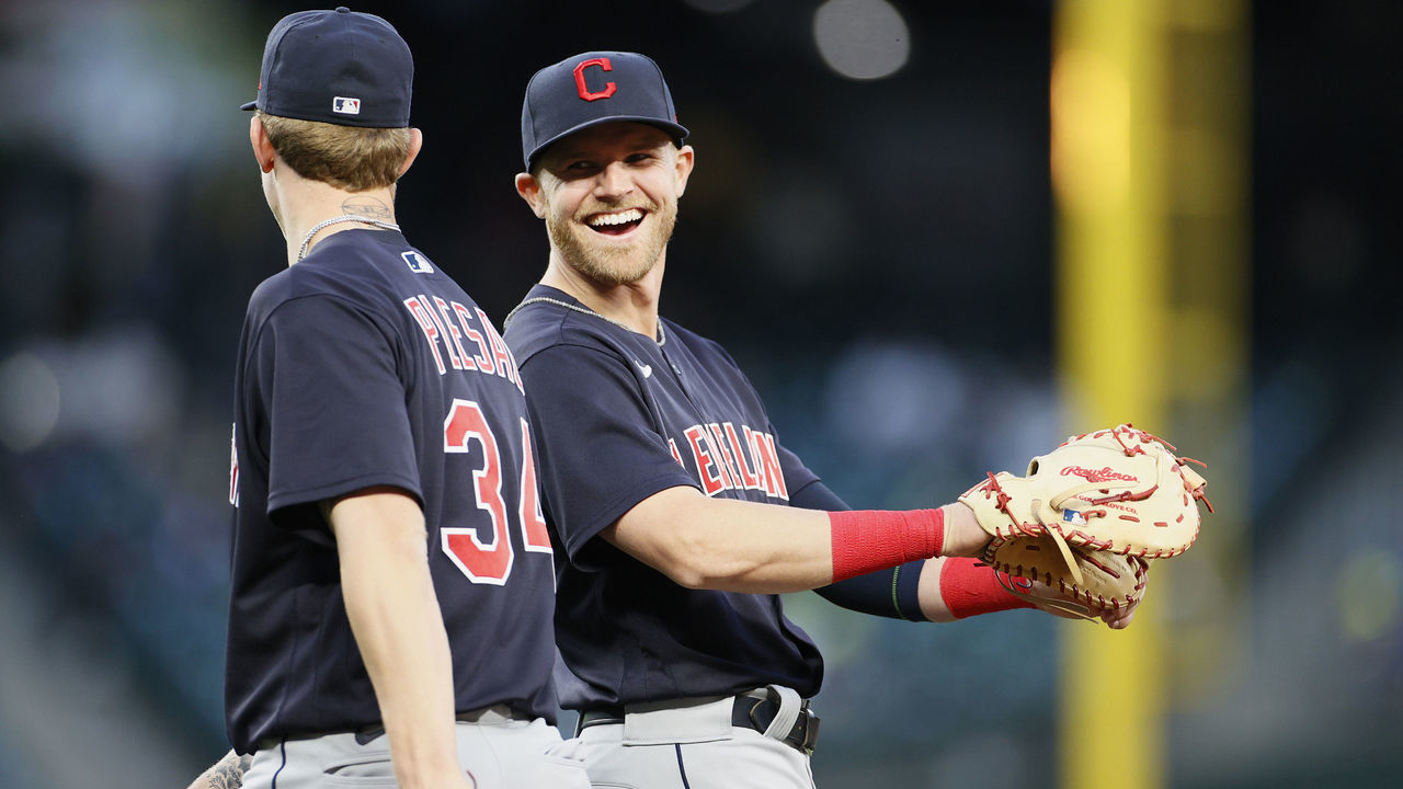 SEATTLE, WASHINGTON - MAY 13: Zach Plesac #34 and Jake Bauers #10 of the Cleveland Indians react after an out against the Seattle Mariners during the fourth inning at T-Mobile Park on May 13, 2021 in Seattle, Washington.