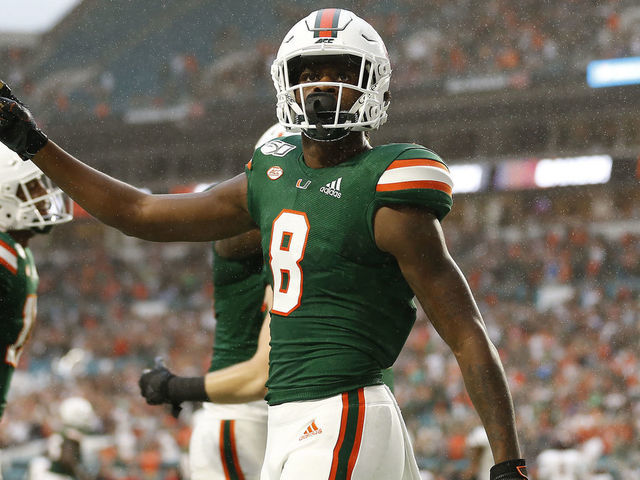 MIAMI, FLORIDA - NOVEMBER 09: Dee Wiggins #8 of the Miami Hurricanes reacts after a touchdown against the Louisville Cardinals during the first half at Hard Rock Stadium on November 09, 2019 in Miami, Florida.