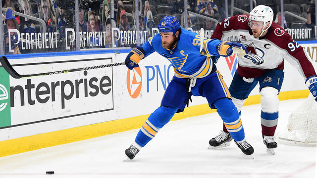 ST. LOUIS, MO - APRIL 24: St. Louis Blues center Ryan O'Reilly (90) and Colorado Avalanche left wing Gabriel Landeskog (92) go after a loose puck during a NHL game between the Colorado Avalanche and the St. Louis Blues on April 24, 2021, at Enterprise Center, St. Louis, Mo. ,