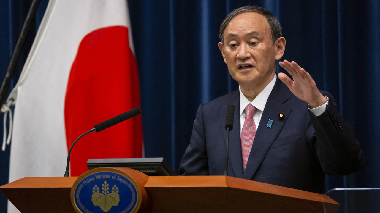 Japanese Prime Minister Yoshihide Suga speaks during a press conference at the Prime Minister's official residence in Tokyo on May 14, 2021, as the government expanded a coronavirus state of emergency to three more regions adding Hokkaido, Okayama and Hiroshima.