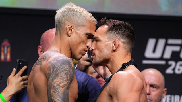 HOUSTON, TEXAS - MAY 14: (L-R) Charles Oliveira of Brazil and Michael Chandler face off during the UFC 262 ceremonial weigh-in at George R. Brown Convention Center on May 14, 2021 in Houston, Texas.