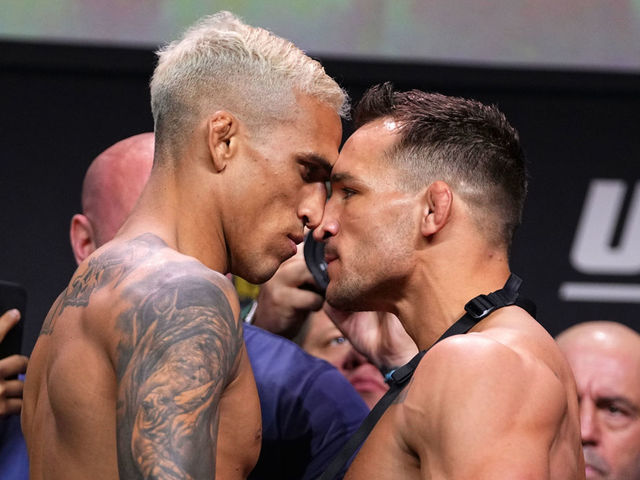 HOUSTON, TEXAS - MAY 14: (L-R) Charles Oliveira of Brazil and Michael Chandler face off during the UFC 262 ceremonial weigh-in at George R. Brown Convention Center on May 14, 2021 in Houston, Texas.
