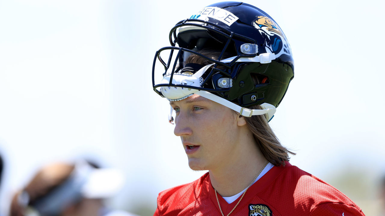 JACKSONVILLE, FLORIDA - MAY 15: Trevor Lawrence #16 of the Jacksonville Jaguars looks on during Jacksonville Jaguars Training Camp at TIAA Bank Field on May 15, 2021 in Jacksonville, Florida.