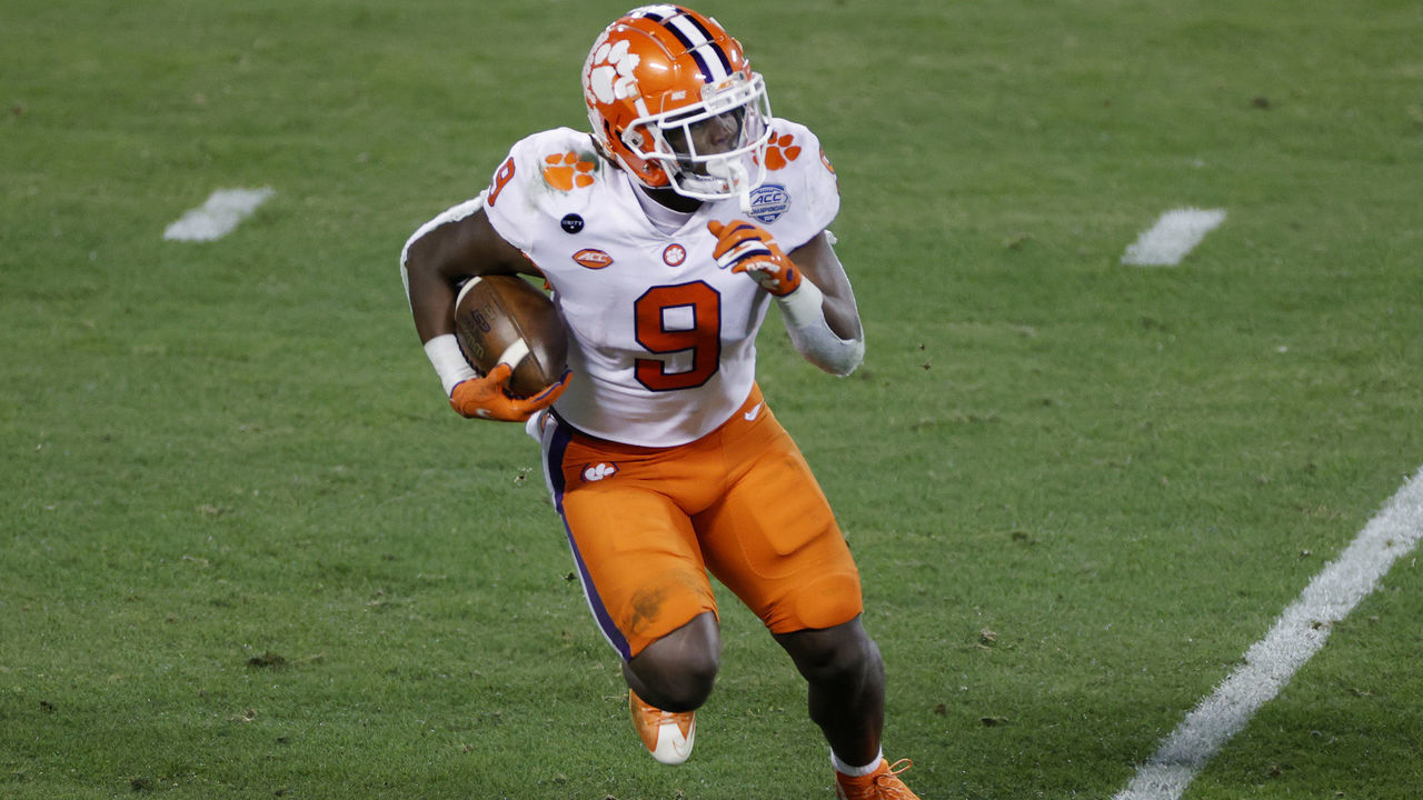 CHARLOTTE, NORTH CAROLINA - DECEMBER 19: Running back Travis Etienne #9 of the Clemson Tigers runs with the ball on a kickoff return in the second half against the Notre Dame Fighting Irish during the ACC Championship game at Bank of America Stadium on December 19, 2020 in Charlotte, North Carolina.