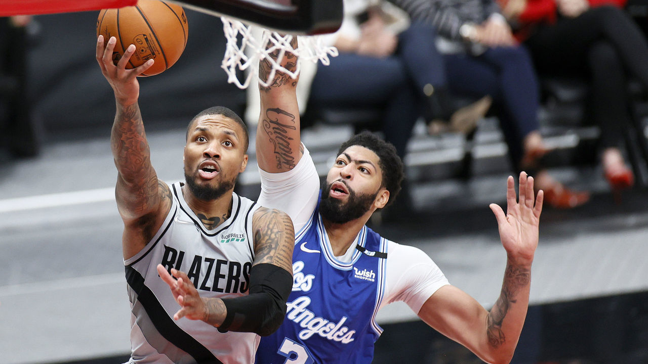 PORTLAND, OREGON - MAY 07: Damian Lillard #0 of the Portland Trail Blazers drives to the basket against Anthony Davis #3 of the Los Angeles Lakers during the third quarter at Moda Center on May 07, 2021 in Portland, Oregon.
