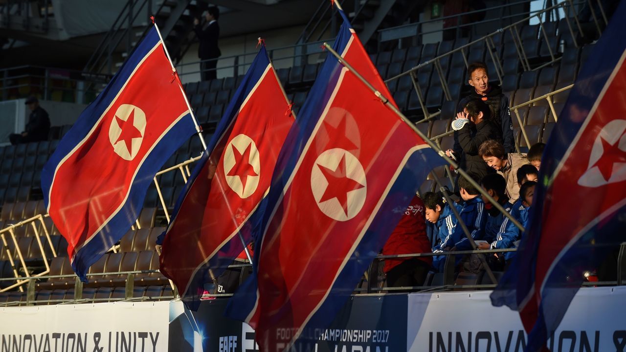 Supporters of the North Korean women's football team gather at a stadium prior to a football match between North Korea and South Korea at the EAFF E-1 football championship in Chiba on December 11, 2017.