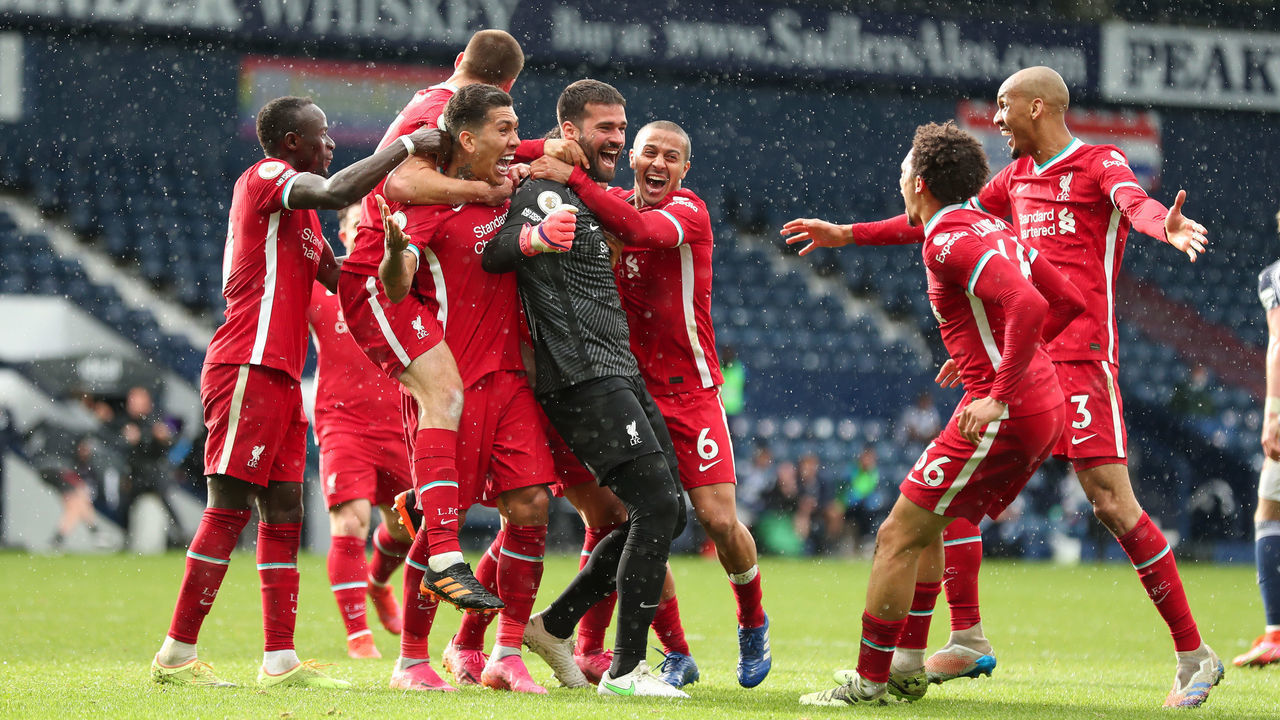 WEST BROMWICH, ENGLAND - MAY 16: Goalkeeper Alisson Becker of Liverpool celebrates after scoring a goal to make it 1-2 during the Premier League match between West Bromwich Albion and Liverpool at The Hawthorns on May 16, 2021 in West Bromwich, United Kingdom.