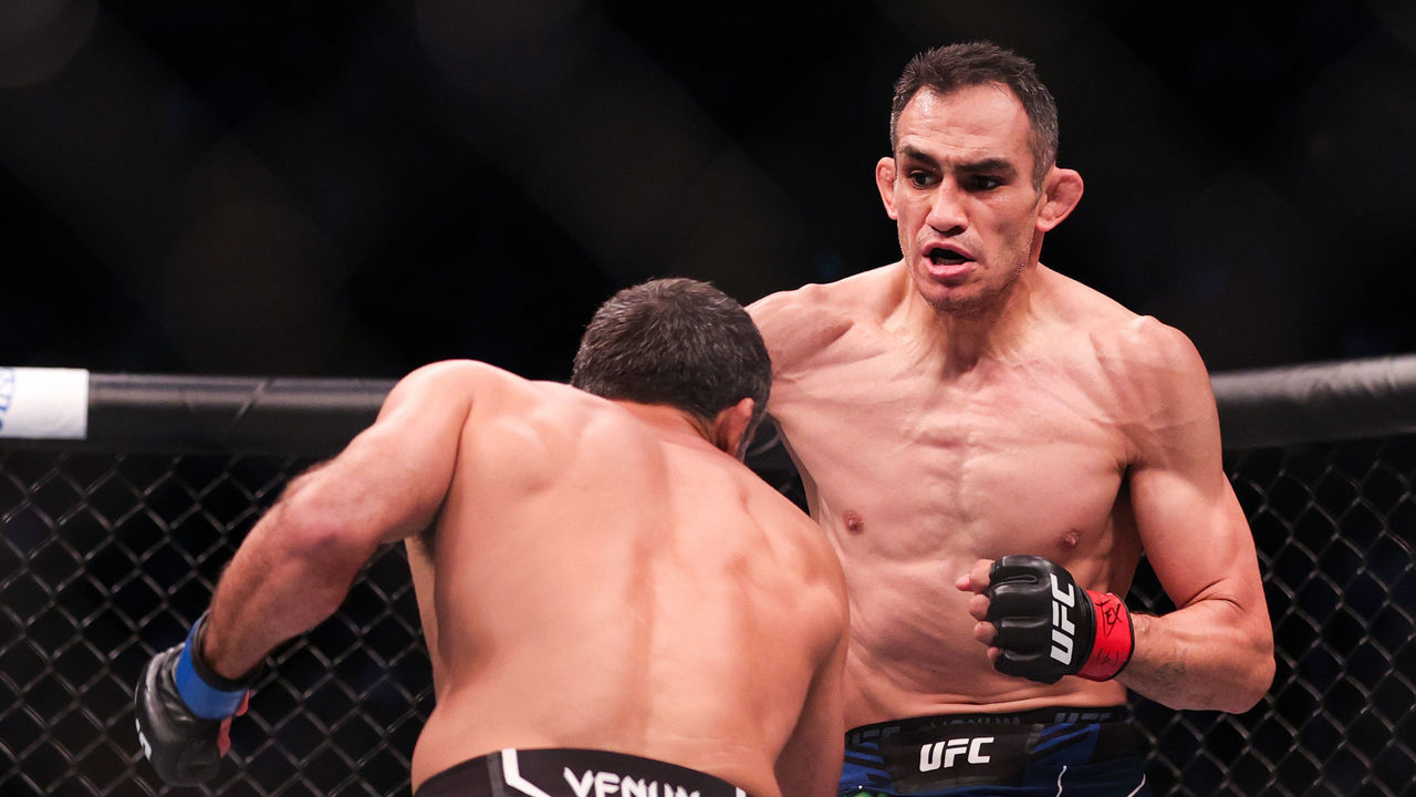 HOUSTON, TEXAS - MAY 15: Tony Ferguson and Beneil Dariush of Iran exchange punches during their Lightweight Bout at the UFC 262 event at Toyota Center on May 15, 2021 in Houston, Texas.