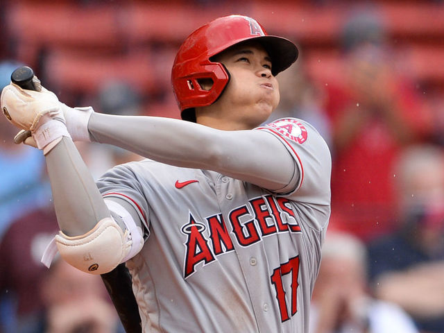 BOSTON, MA - MAY 16: Shohei Ohtani #17 of the Los Angeles Angels hits a game-winning two-run home run in the ninth inning against the Boston Red Sox at Fenway Park on May 16, 2021 in Boston, Massachusetts.