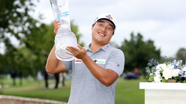 MCKINNEY, TEXAS - MAY 16: K.H. Lee of South Korea celebrates with the trophy after winning the AT&T Byron Nelson at TPC Craig Ranch on May 16, 2021 in McKinney, Texas. Lee won the AT&T Byron Nelson playing -25 in the tournament.