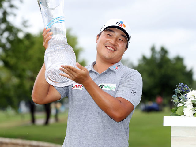MCKINNEY, TEXAS - MAY 16: K.H. Lee of South Korea celebrates with the trophy after winning the AT&T Byron Nelson at TPC Craig Ranch on May 16, 2021 in McKinney, Texas. Lee won the AT&T Byron Nelson playing -25 in the tournament.