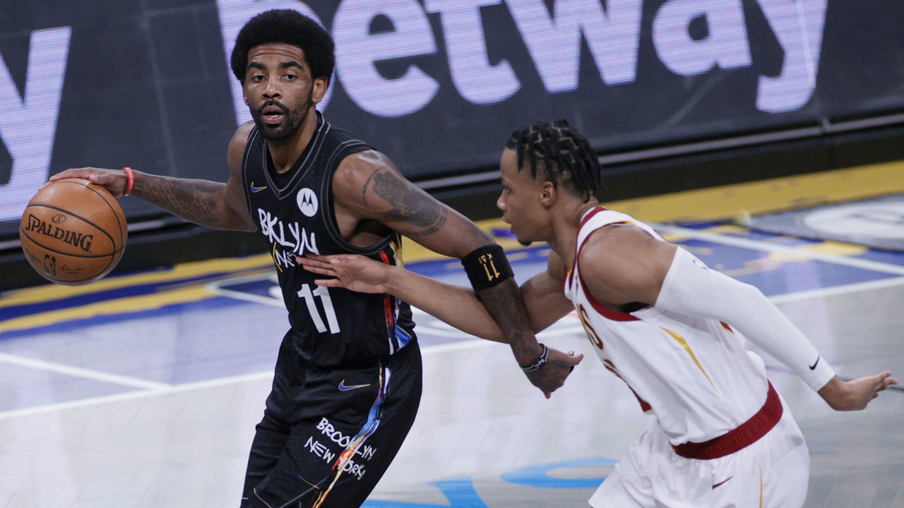 NEW YORK, NEW YORK - MAY 16: Kyrie Irving #11 of the Brooklyn Nets dribbles as Isaac Okoro #35 of the Cleveland Cavaliers defends during the first half at Barclays Center on May 16, 2021 in the Brooklyn borough of New York City.