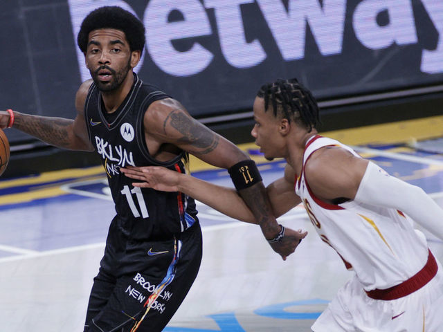 NEW YORK, NEW YORK - MAY 16: Kyrie Irving #11 of the Brooklyn Nets dribbles as Isaac Okoro #35 of the Cleveland Cavaliers defends during the first half at Barclays Center on May 16, 2021 in the Brooklyn borough of New York City.