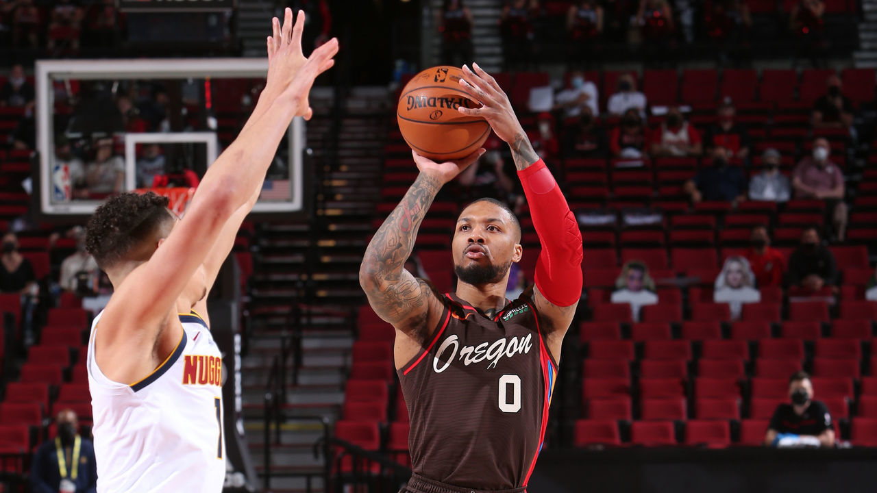 PORTLAND, OR - MAY 16: Damian Lillard #0 of the Portland Trail Blazers shoots a three point basket against the Denver Nuggets on May 16, 2021 at the Moda Center Arena in Portland, Oregon. Mandatory Copyright Notice: Copyright 2021 NBAE