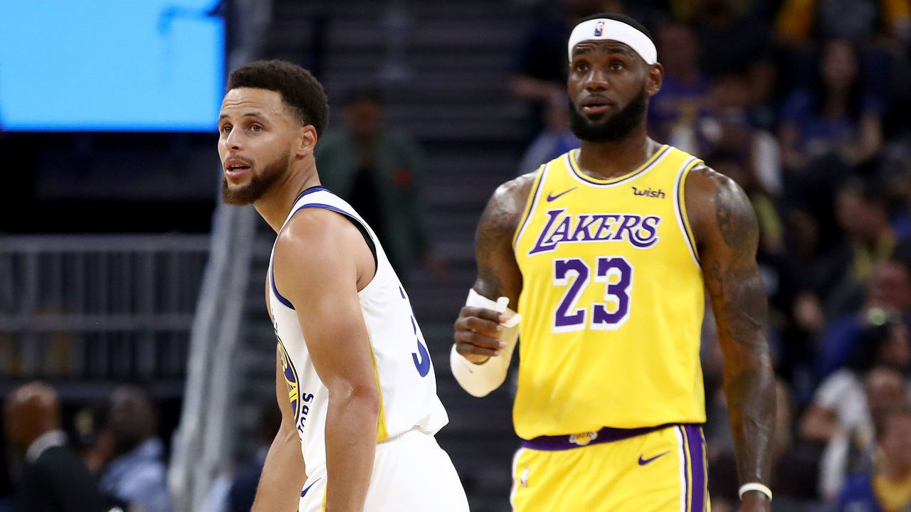 SAN FRANCISCO, CALIFORNIA - OCTOBER 05: LeBron James #23 of the Los Angeles Lakers talks to Stephen Curry #30 of the Golden State Warriors during their game at Chase Center on October 05, 2019 in San Francisco, California.